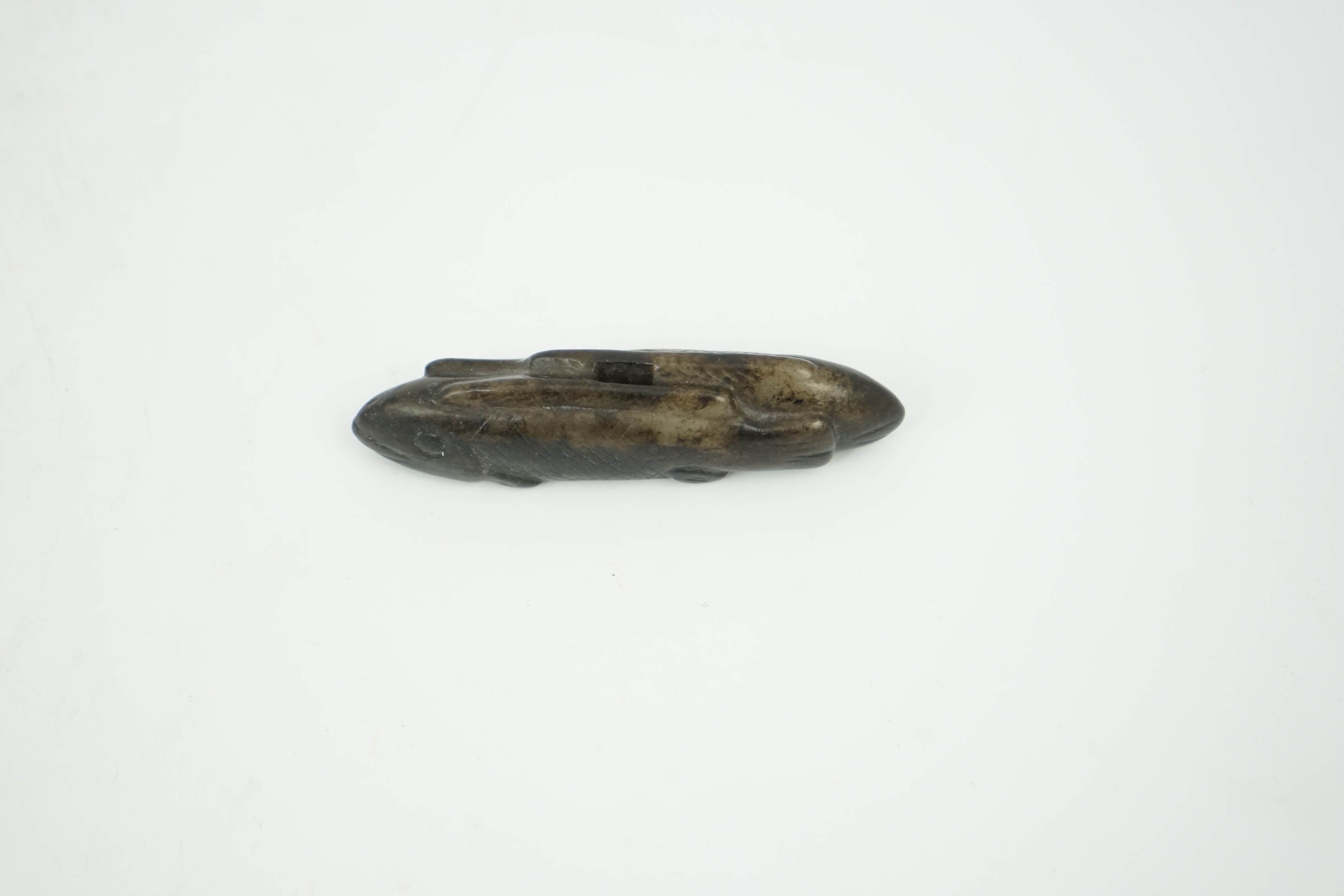 A Chinese black and white jade 'fish' sword fitting, Song or later